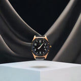 Versatile men's rose gold watch displayed against a soft black drape, embodying modern sophistication.