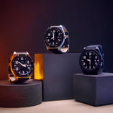 Three watches at different level with a dark background